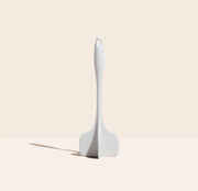 GIR Get It Right - GIR Quad Chopper: Studio, a versatile white silicone kitchen tool with embossed handle, designed for easy chopping and mashing without scratching pans.