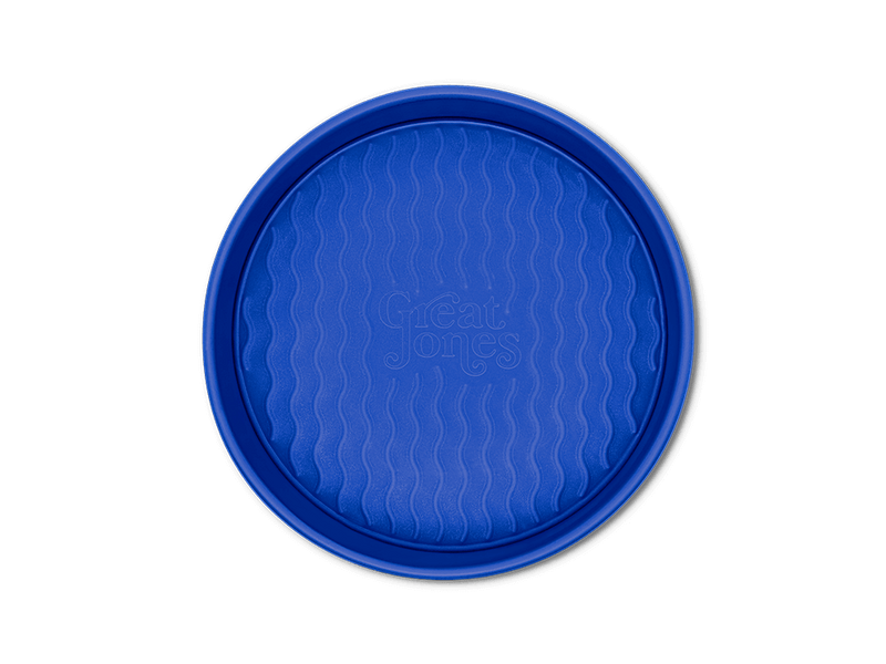 Great Jones | Patty Cake - Broccoli, a round baking container with a wavy, corrugated bottom, designed for nonstick, kid-friendly baking.