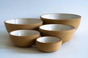 RachaelPots | Set of Three Nesting Bowls: Five ceramic bowls in sandy-brown, speckled finish, showcasing varying sizes for versatile food prep and serving. Handcrafted in Brooklyn.