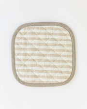 MagicLinen - Linen pot-holder with quilted detailing, heat-insulating padding, and hanging loop, shown in a close-up view. Perfect for kitchen safety and style.
