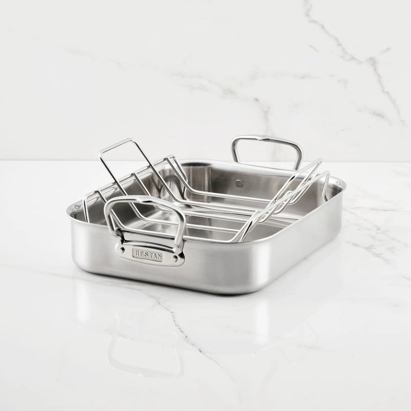 Hestan Provisions | Classic Roaster with Rack, 14.5 Inches, on marble countertop, featuring durable stainless steel construction and ergonomic handles for efficient cooking and serving.