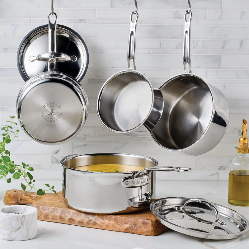 Hestan Provisions | Stainless Steel Lids Large, 12.5 shown with matching cookware, highlighting durable tri-ply construction and ergonomic handles, ideal for enhancing culinary experiences at Athens Cooks.