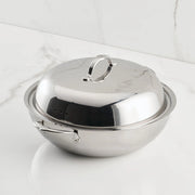 Hestan Provisions | Stainless Steel Lids Dome, 14 on a countertop, features a tri-ply construction and ergonomic handle, ideal for enhancing cooking performance and flavor retention.