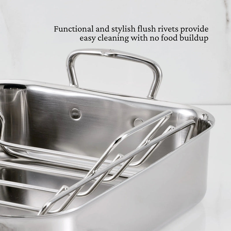 Hestan | Polished Clad Stainless Steel Roaster with Rack, Small, featuring flush rivets and tubular handles for easy cleaning and efficient handling.