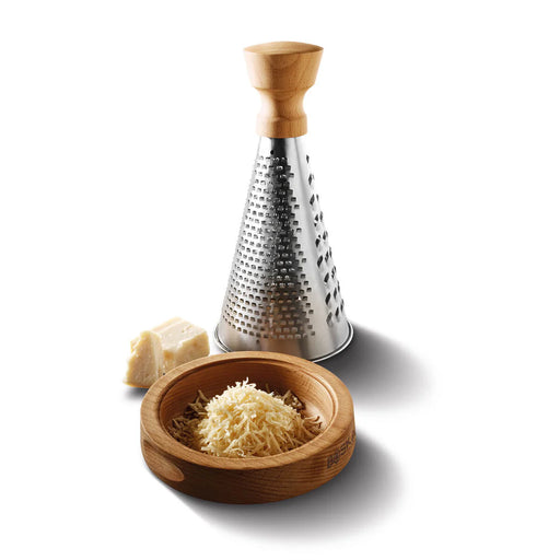Boska | Table Grater Oslo with a wooden handle, shown with a small wooden bowl of freshly grated cheese and a wedge of hard cheese beside it.