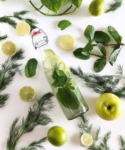 Le Parfait - 500ml French Glass Swing Top Bottle with mint, lime, and herb garnish, ideal for fermenting or storing beverages.