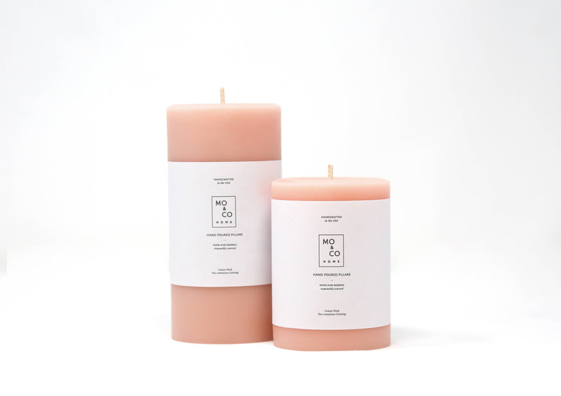 Mo&Co Home - 100% Beeswax Pillar Candles | Rose Pink: 3x6 Inch candle with white label, showcased in a kitchen store setting.