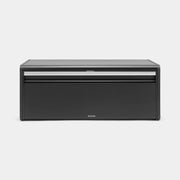 Brabantia USA Inc | Fall Front Bread Box Matt Black with a sleek design, featuring a silver handle and flat top for canisters, ideal for saving kitchen space.