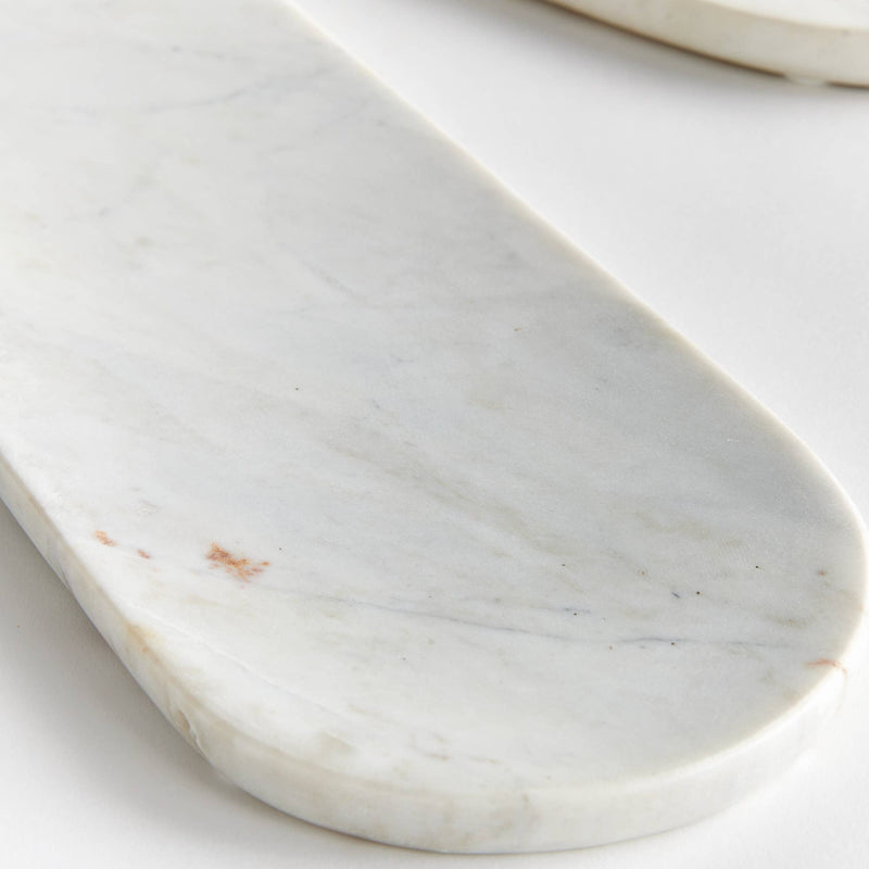 Napa Home & Garden - Amal Marble Trays, featuring an elegant close-up of sleek white marble with subtle brown spots, ideal for serving cheese and snacks.