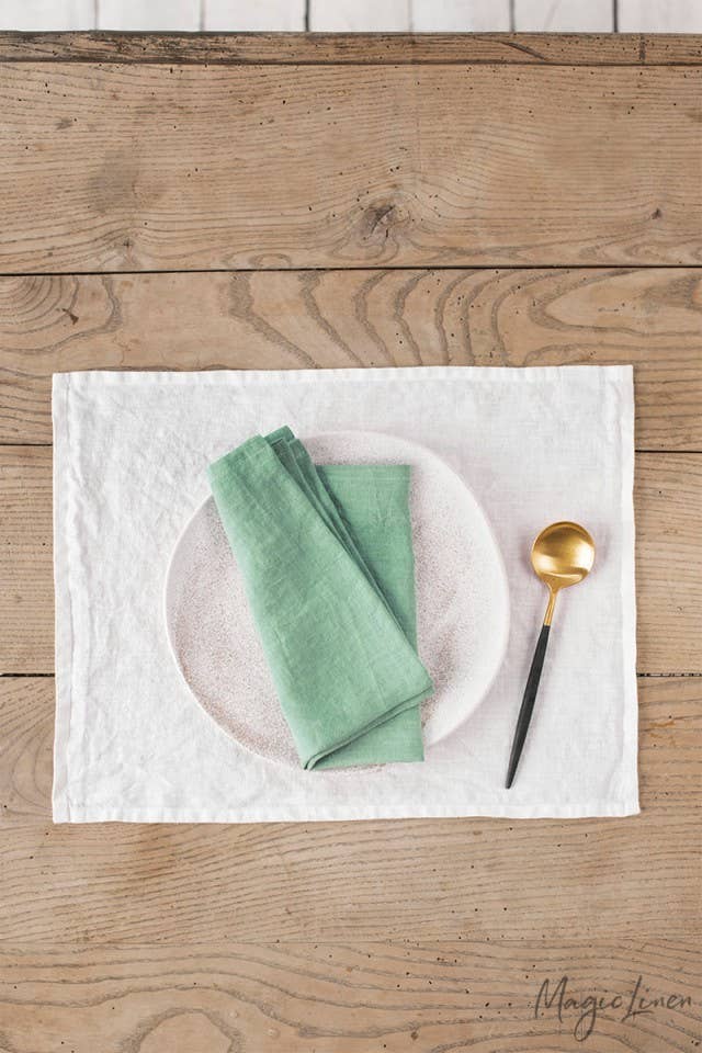 MagicLinen - Set of 2 linen napkins, displayed with a spoon on a table, showcasing their versatile, sustainable design for stylish table decor.