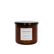 Slow North - Orange + Clove - Signature 3-Wick Non-Toxic Candle, featuring an amber-brown glass jar with a black lid, hand-poured in Austin, TX.