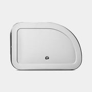 Brabantia USA Inc | Roll Top Bread Box Matte Steel with a round button lid, designed for efficient storage, visible near a sink area.