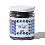 Villa Jerada - Nigella - 100g jar with white lid, featuring blue geometric label, filled with black nigella seeds, a versatile spice with health benefits.