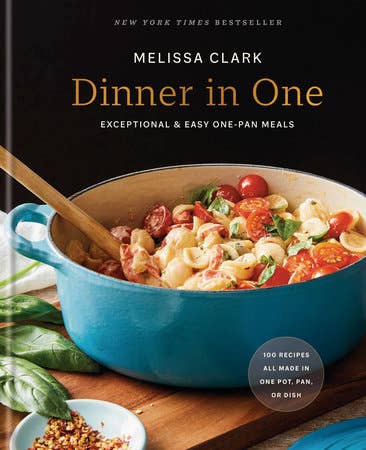 Cover of Dinner in One by Melissa Clark, featuring a blue Dutch oven with pasta, tomatoes, herbs, and a subtitle about easy one-pan meals.
