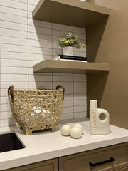 L'AVANT Collective - Laundry Detergent Fresh Linen on counter with dryer balls, wicker basket, and plant, embodying eco-friendly, gentle fabric care in a chic, minimalist setup.