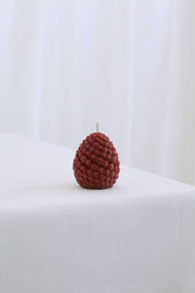 Mo&Co Home Exclusive: Sculpted Beeswax Pine Cone Candle, small size, showcasing intricate pine-cone texture, hand-poured beeswax, ideal for elegant, seasonal decor and gifting.