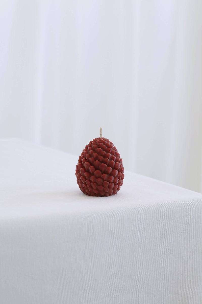 Mo&Co Home Exclusive: Sculpted Beeswax Pine Cone Candle, small size, showcasing intricate pine-cone texture, hand-poured beeswax, ideal for elegant, seasonal decor and gifting.