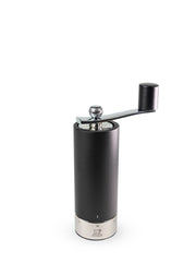 Peugeot | Isen Pepper Mill, Matte Black: A cylindrical, matte-black hand-cranked grinder with a stainless-steel base and removable metal crank, featuring adjustable grind settings.