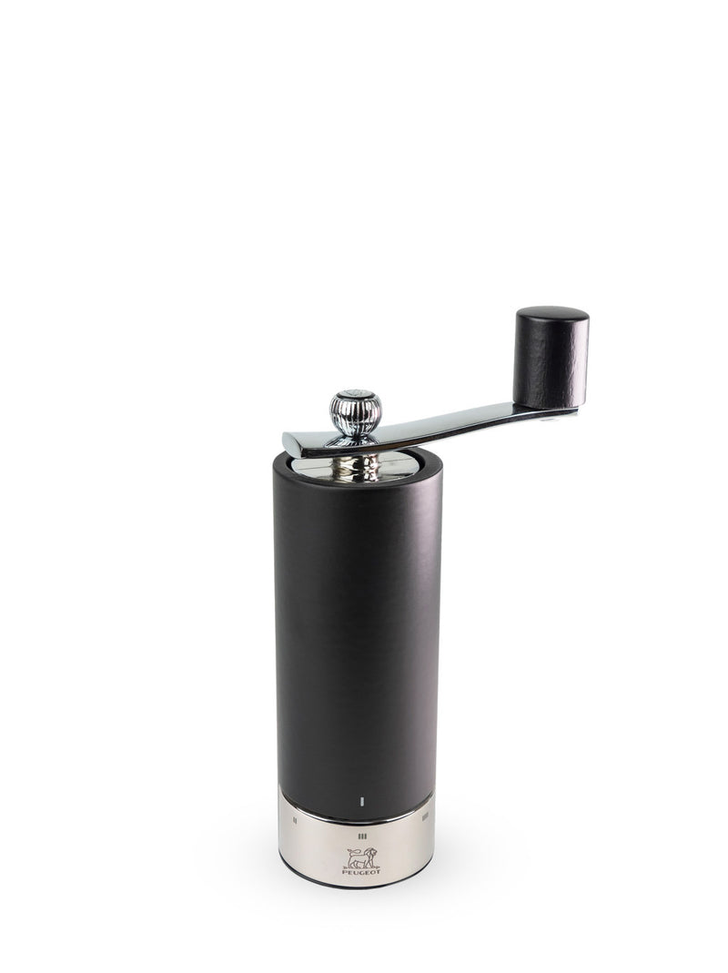 Peugeot | Isen Pepper Mill, Matte Black: A cylindrical, matte-black hand-cranked grinder with a stainless-steel base and removable metal crank, featuring adjustable grind settings.