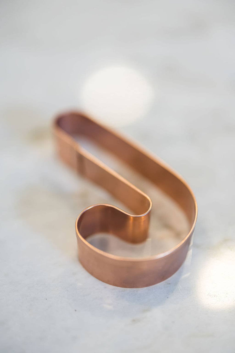 Galley and Fen - Christmas Cookie Cutters - Set of 6, featuring a copper letter S cutter on marble, ideal for festive baking with precise cuts.