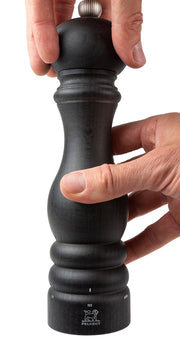 Peugeot | Paris u'Select Wood Salt Mill, 9 inches, shown being twisted by hands, highlighting its sleek design and innovative grinding mechanism with lifetime guarantee.