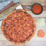 Lamson Leather Sheath for 14 Pizza Cutter/Rocker displayed with pizza. Part of a set, highlighting kitchen tools available at Athens Cooks.