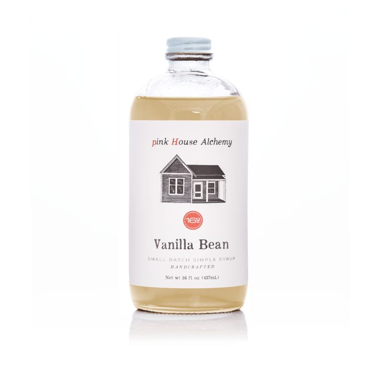 Pink House Alchemy - Vanilla Bean Simple Syrup bottle, showcasing a house emblem on the label, ideal for enhancing culinary creations.