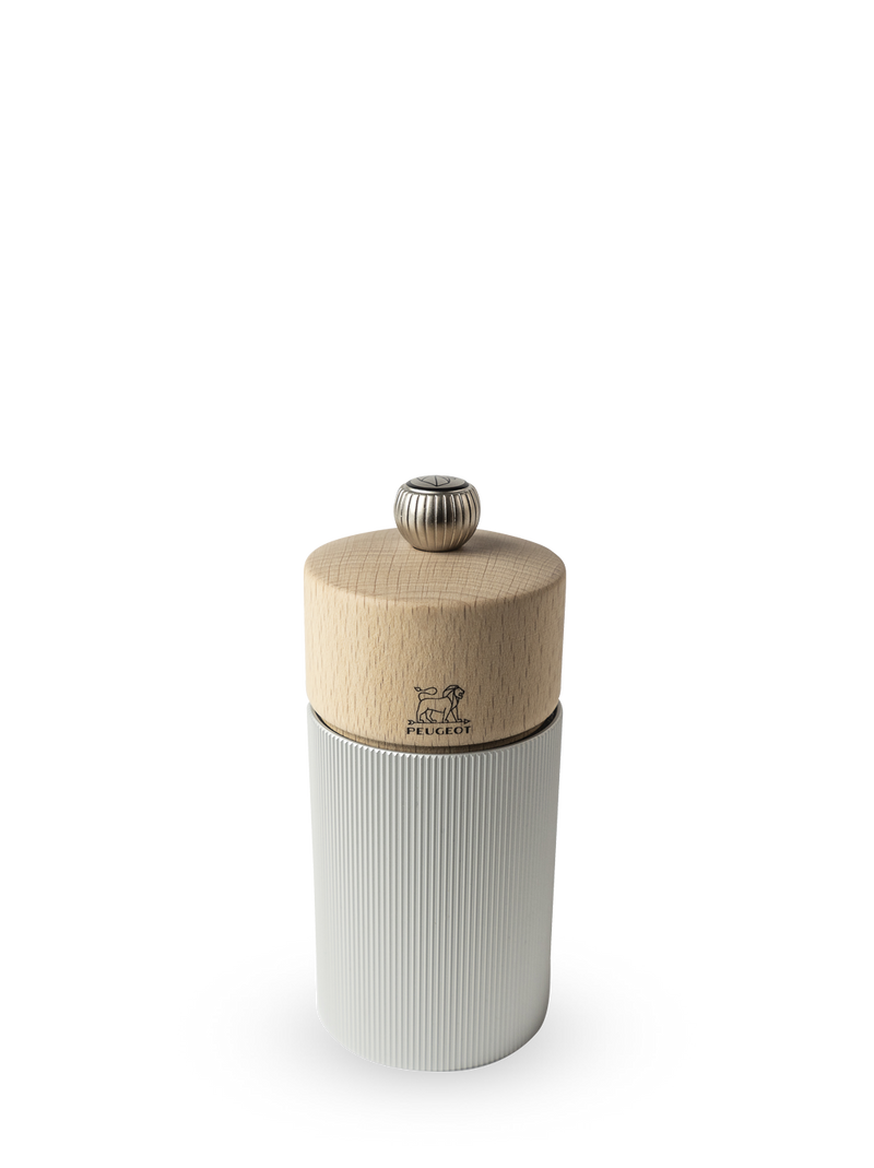 Peugeot | Line Pepper Mill, 4.75 with natural beechwood top, fluted metal knob, ribbed aluminum base, showcasing Peugeot's renowned grinding mechanism. Perfect for sophisticated kitchen settings.