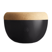 Emile Henry | Deep Storage Bowl, Truffle: A modern half-sphere container with a matte black ceramic base and removable cork lid, ideal for preserving fruits and root vegetables.