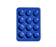 Great Jones | Stud Muffin - Blueberry: A nonstick, 12-hole muffin pan designed for even heat distribution and easy cleanup, ideal for baking muffins or cupcakes.