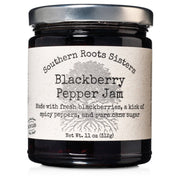 Southern Roots Sisters Blackberry Pepper Jam in a clear jar, combining fresh blackberries and spicy peppers, perfect for pairing with cheese or as a unique burger topping.