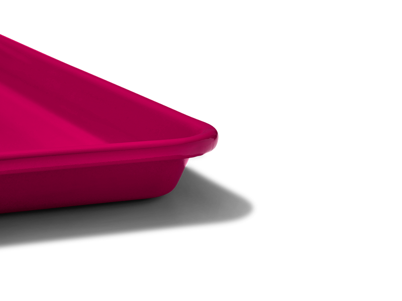 Great Jones | Little Sheet - Pepper, a nonstick quarter-sized baking tray, perfect for small ovens and personal bakes, showcased in a close-up image.