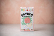 Hayden Flour Mills - Molly Yeh x HFM Confetti Cake Mix box featuring a rose graphic and sprinkles, photographed against a pink–peach background.