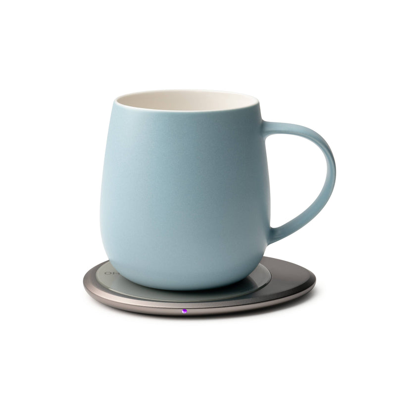 OHOM - Ui 3 Self-heating Mug Set: Moonmist Blue, shown on a smart coaster, seamlessly combines style and technology for optimal beverage enjoyment.