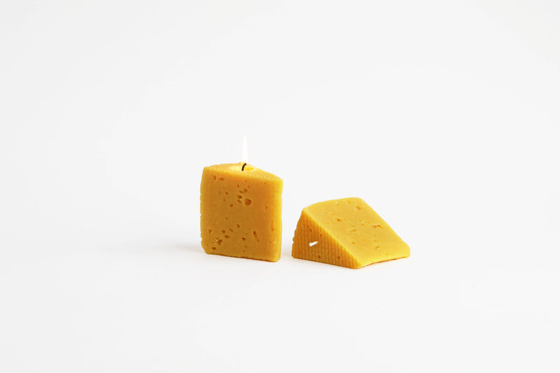 Artifaqt - Blue Cheese Beeswax Candle, shaped like cheese, symbolizes Birchrun Hills' dairy craftsmanship, made from pure Chester County beeswax. Burns for 20 hours.