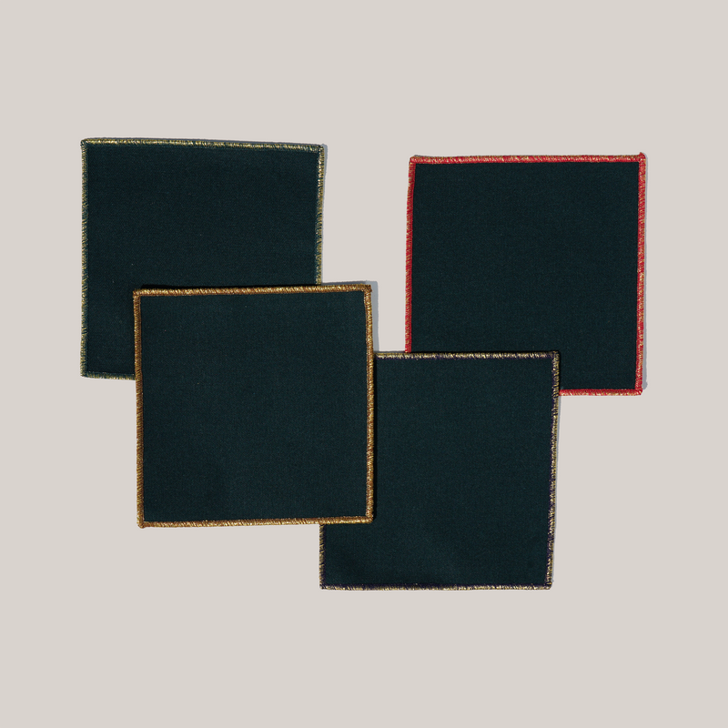 ATELIER SAUCIER - Tinsel Cocktail Napkins | Set of 4: Elegant dark cloths with festive gold, bronze, red, and metallic stitching, perfect for holiday drinks.