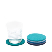 Graf Lantz - Bierfilzl Merino Wool Felt Round Coaster Multi 6 Pack: Ocean next to a glass of water with ice cubes.