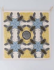 Hearth and Harrow - Honeybee Tea Towel - Organic Cotton - Oversized 30 x 30, featuring bees and honeycomb motifs, clipped to a wall for display.