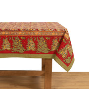Couleur Nature - Noel Red & Green French Tablecloth showcases festive Christmas patterns with trees and holly, handprinted on cotton, ideal for holiday dining.