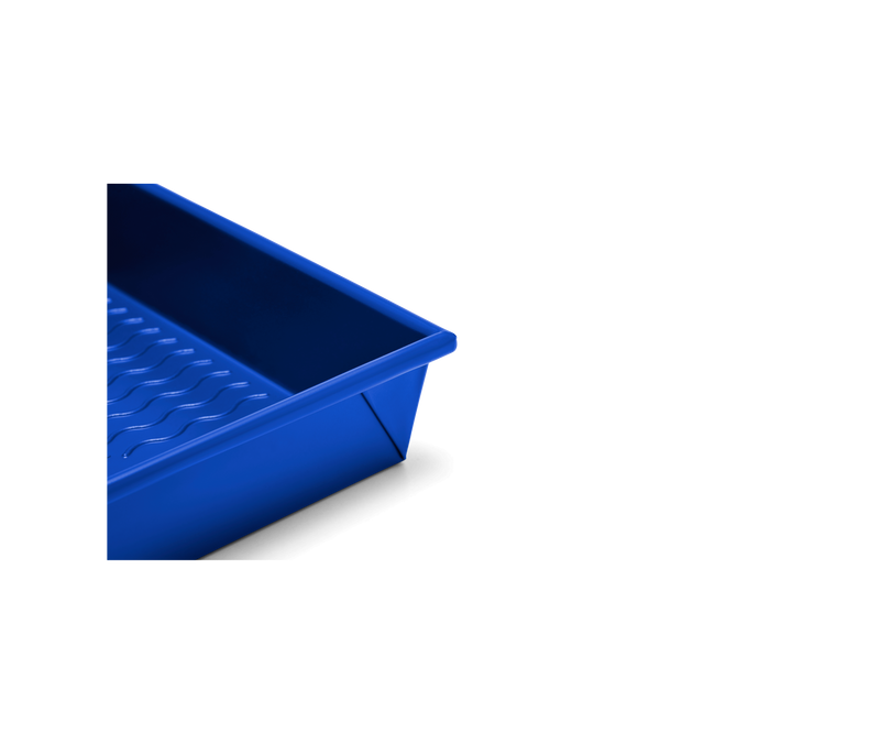 Great Jones | Square One - Blueberry baking pan with a wavy, corrugated bottom for easy release, suitable for even, golden results. Oven-safe, dishwasher-friendly, nonstick, and nontoxic.