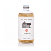 Pink House Alchemy - Lavender Simple Syrup in a clear glass bottle, ideal for enhancing culinary creations with its aromatic blend of spices, citrus, and mint.