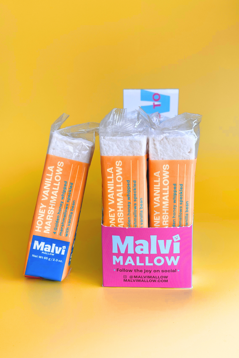 Malvi Mallow - Honey Vanilla 4-Pack Marshmallows, Case of 12 Packs, displayed in a pink box, perfect for toasting or topping cocoa.