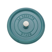 Staub | Round Cocottes - 4 qt Turquoise lid with embossed “LA COCOTTE” and “STAUB” around the central knob, showcasing its durable, heirloom-quality craftsmanship.
