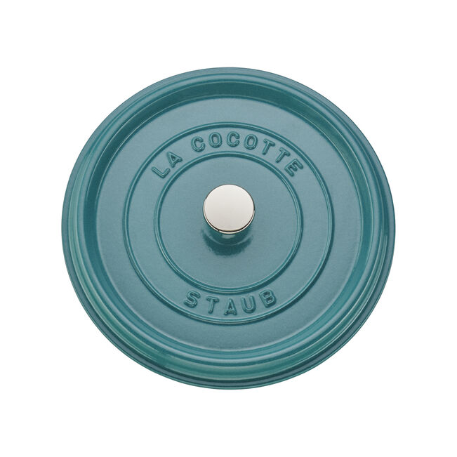 Staub | Round Cocottes - 4 qt Turquoise lid with embossed “LA COCOTTE” and “STAUB” around the central knob, showcasing its durable, heirloom-quality craftsmanship.