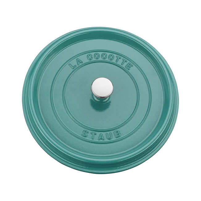 Staub 5.5 qt Round Cocotte lid in teal with stainless-steel knob and LA COCOTTE STAUB embossed, showcasing premium enameled cast-iron craftsmanship.