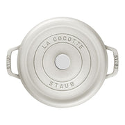 Staub | Round Cocottes - 5.5 qt White Truffle: Top-down view of cast-iron Dutch oven with lid and handles engraved with Staub and La Cocotte.