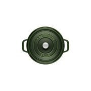 Staub | Round Cocottes - 7 qt Basil: Top view of green enamel lid with embossed LA COCOTTE STAUB, featuring side handles and central knob for self-basting.