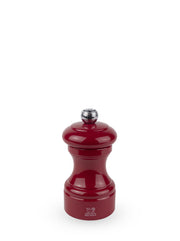 Peugeot | Bistro Pepper Mill, Passion Red: A classic, glossy pepper grinder with a metal adjustment knob, showcasing timeless design and elegance.
