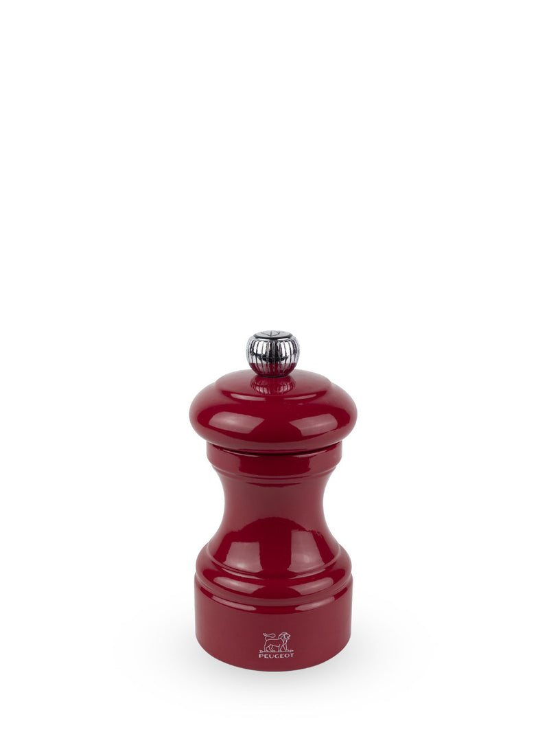 Peugeot | Bistro Pepper Mill, Passion Red: A classic, glossy pepper grinder with a metal adjustment knob, showcasing timeless design and elegance.