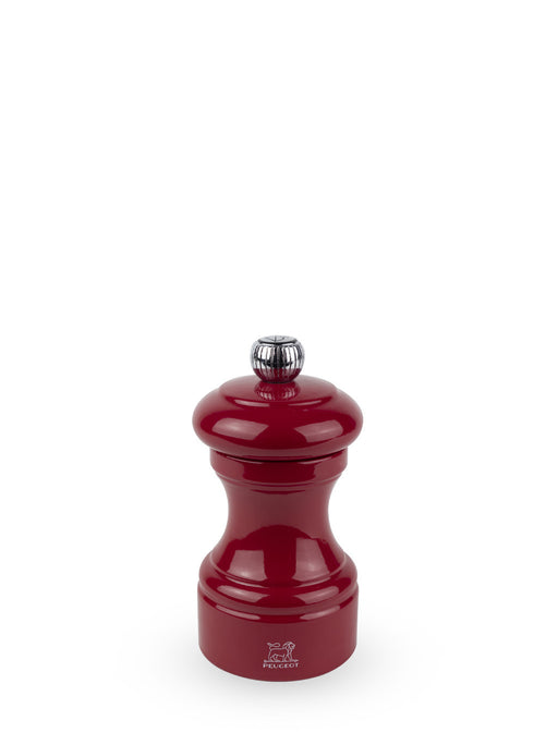 Peugeot | Bistro Pepper Mill, Passion Red: A classic, glossy pepper grinder with a metal adjustment knob, showcasing timeless design and elegance.